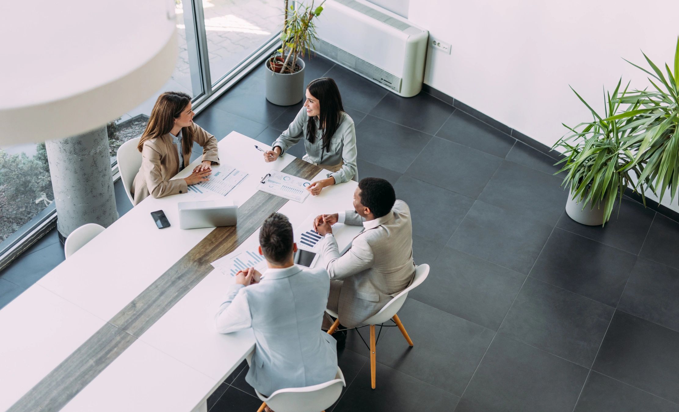 Business professionals reviewing documents in a meeting